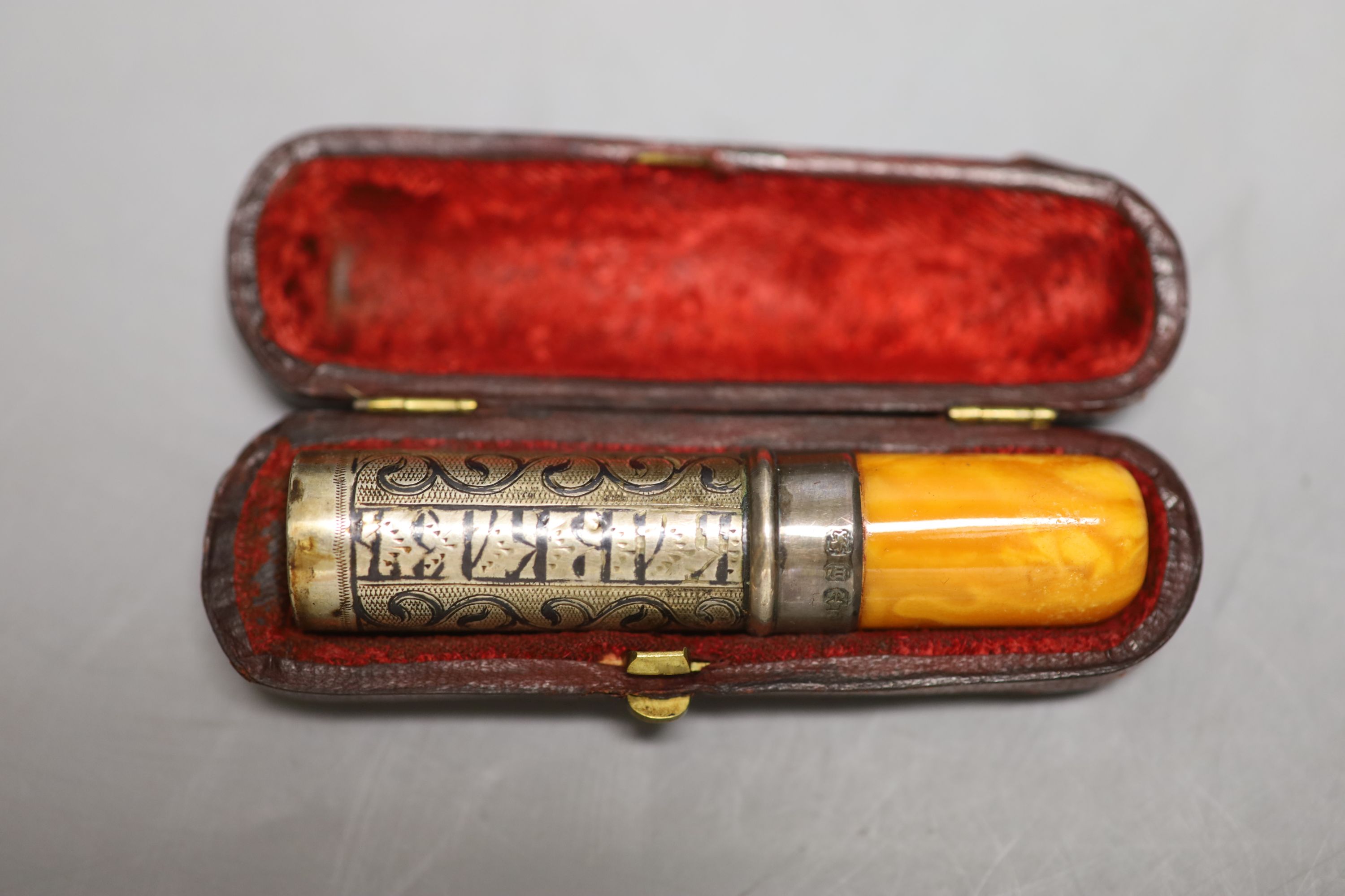 A silver-mounted amber cheroot holder, cased, with Russian inscription, Birmingham 1896 and sundry silver and plated flatware,